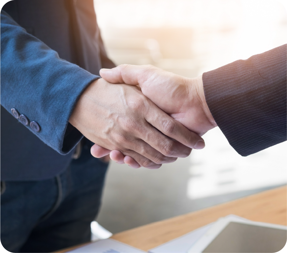 About Us 4 Handshake reflecting REvalu’s trusted NRI property care.